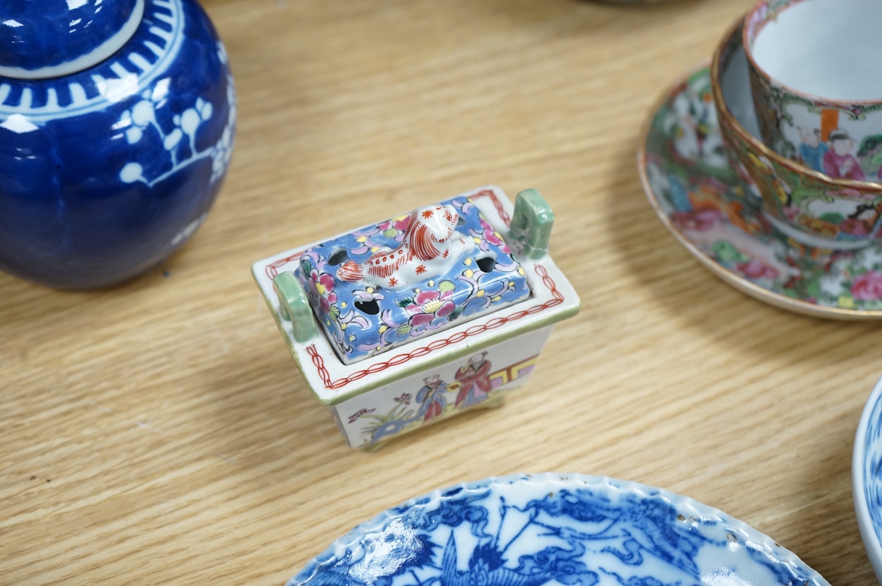 Fourteen pieces of Chinese porcelain and pottery, 19th/20th century to include a pair of blue and white ginger jars, famille rose cup and saucer and a cloisonné pot and cover in the form of an apple, largest 27cm high